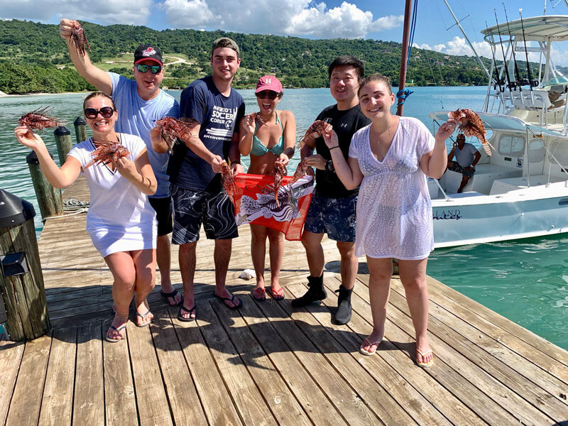 Roger J. Muller, Jr. with family and friends after a lionfish hunt