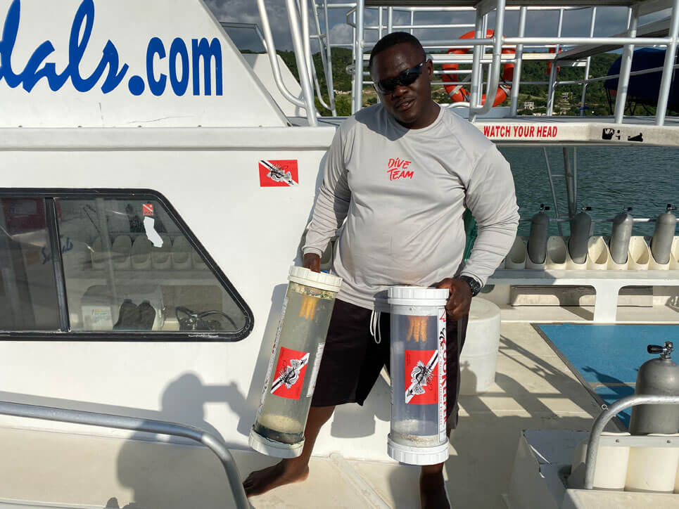 Andre holding zookeepers with Lionfish University stickers