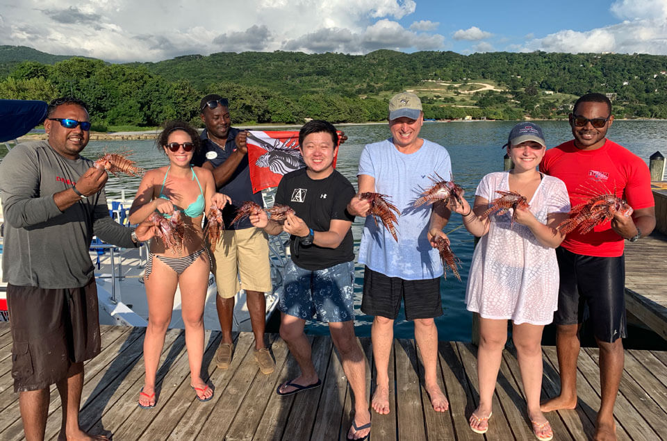 Family with their lionfish catch