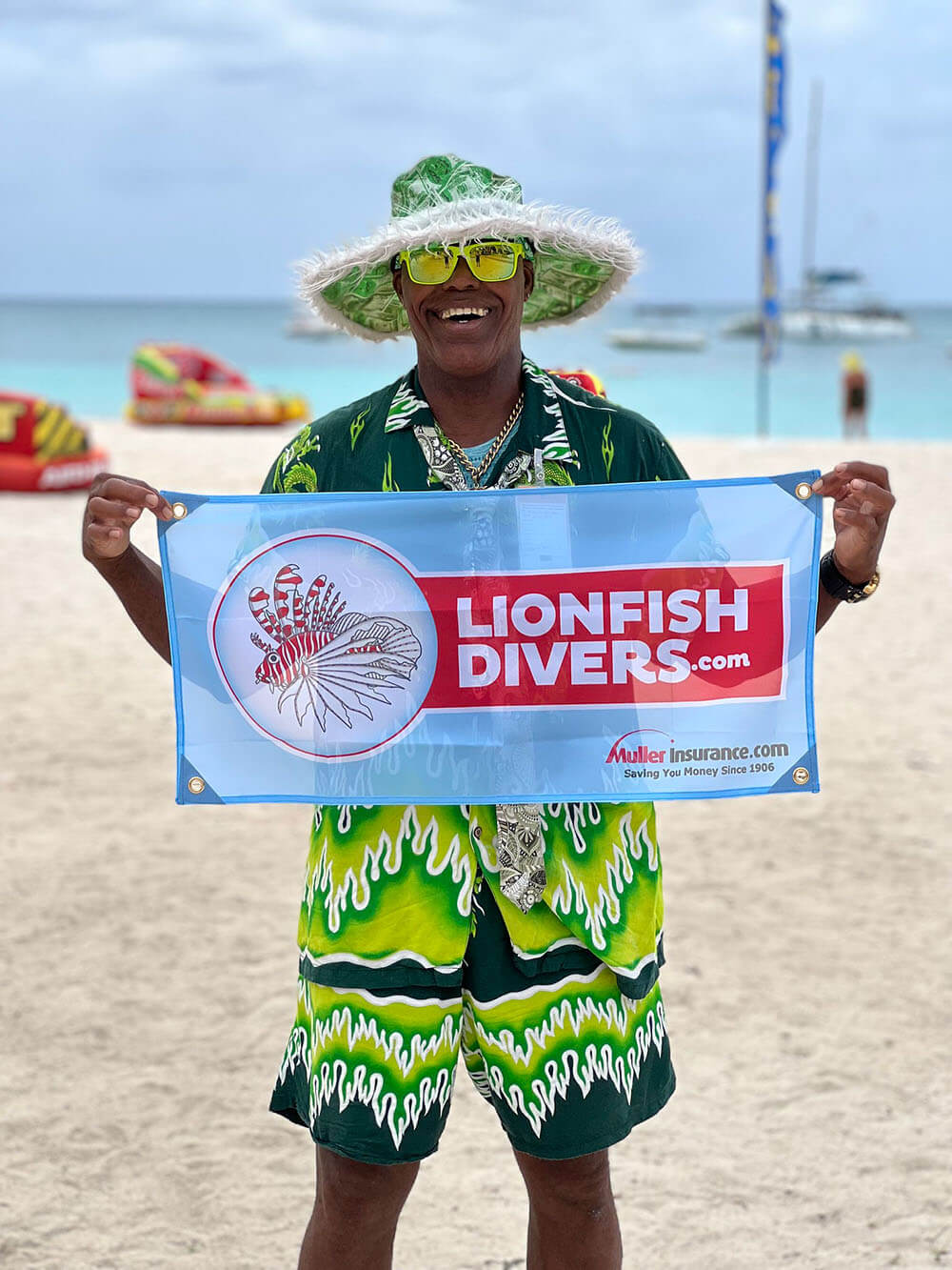 aloe man aruba holding lionfishdivers.com flag