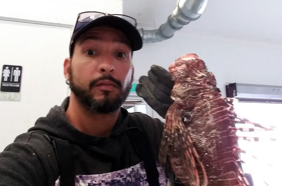 James Alicea holding a lionfish