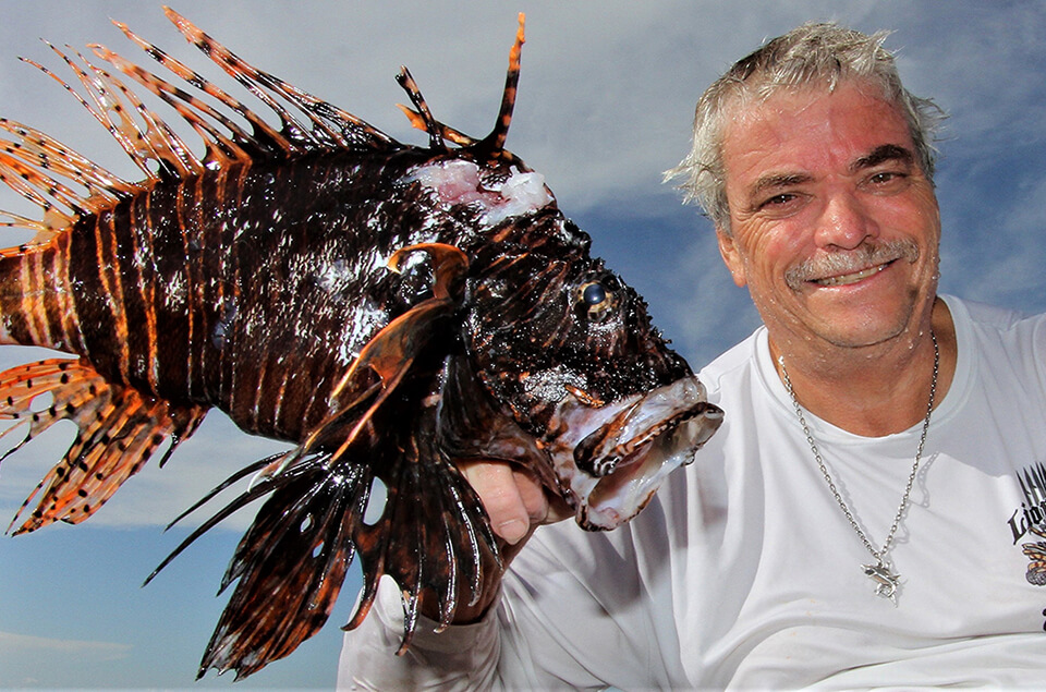 Mark Primo Miller holding lionfish