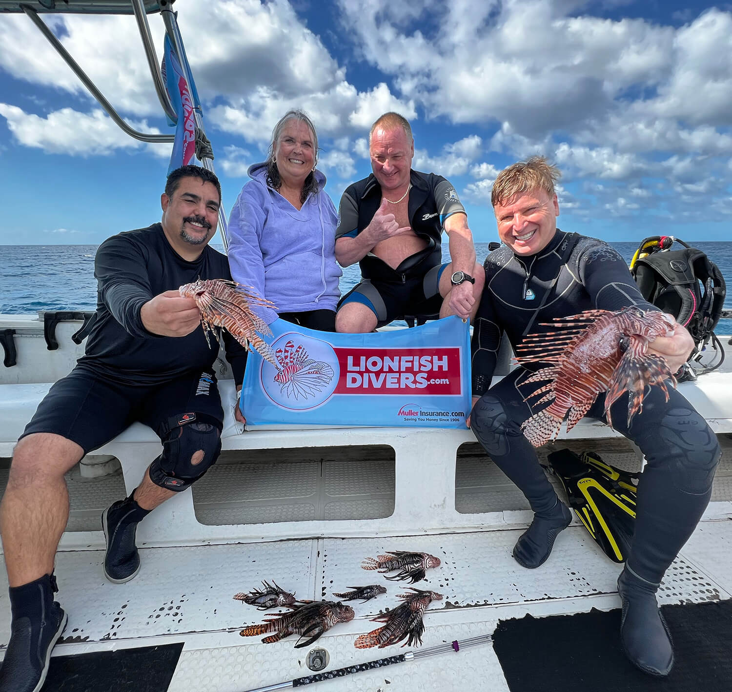 Lionfish hunters on dive boat
