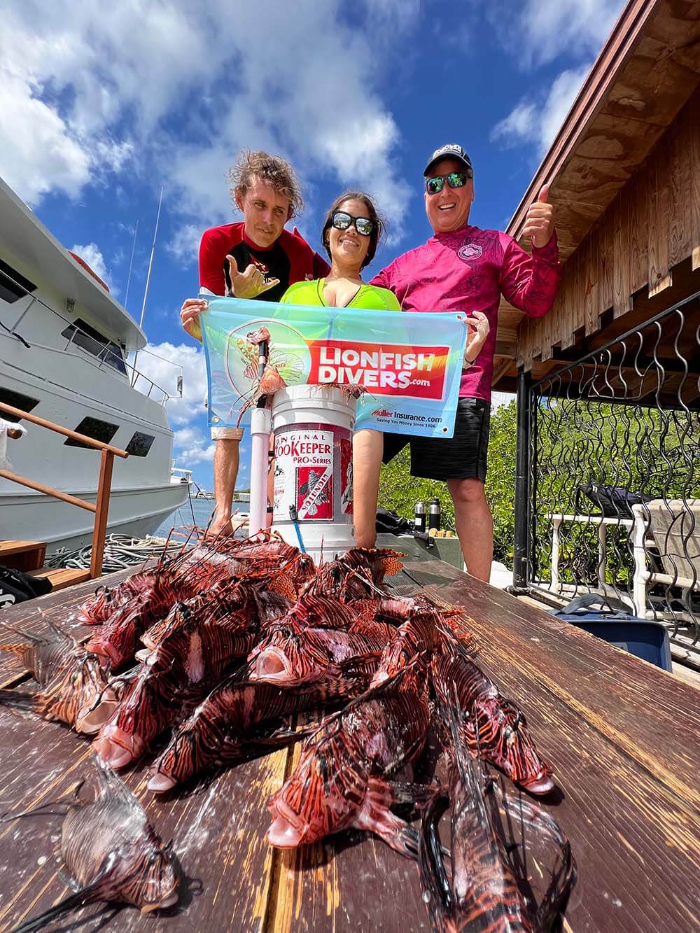 Lukas Moorhead and Roger J. Muller, Jr. with lionfish catch of the day