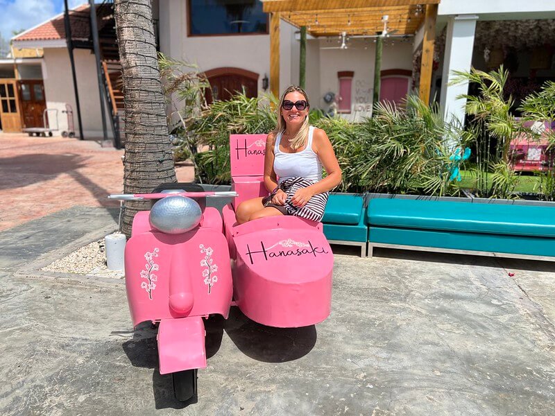 Andrea sitting in ppink sidecar in Aruba