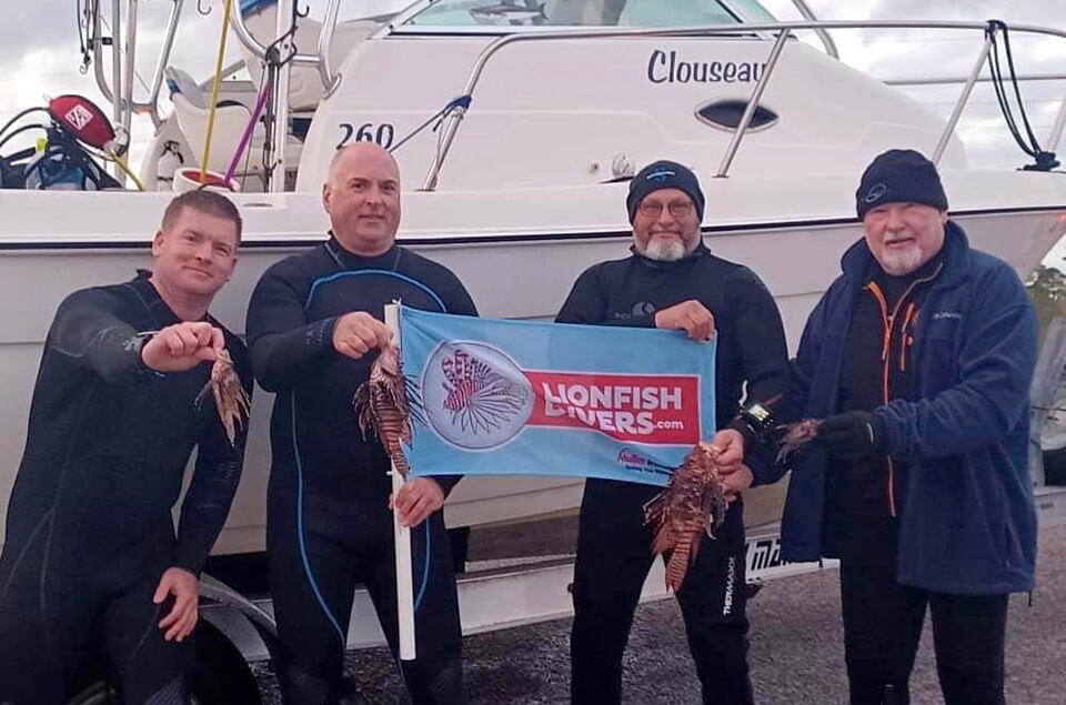 Charles Painter with lionfishdivers.com flag