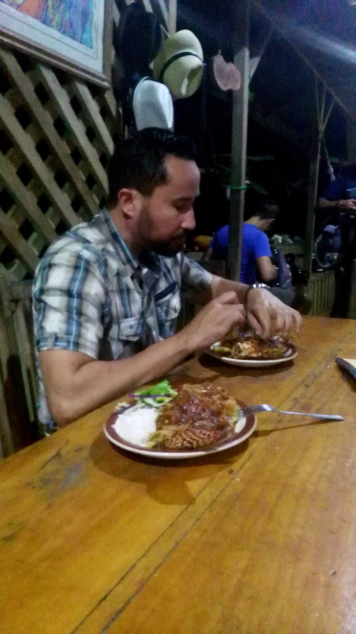 José Ugalde eating lionfish
