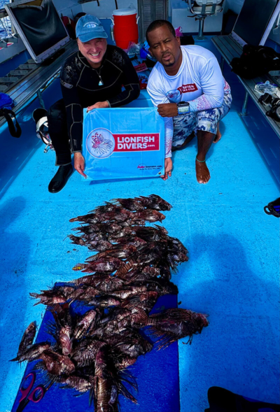 Roger Muller lionfish hunting with Cabrits Dive Center in Aruba.