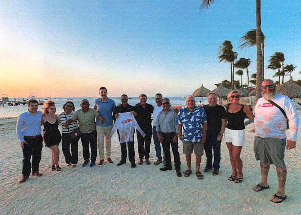 Attendees gather on the beach at Hadicurari Restaurant