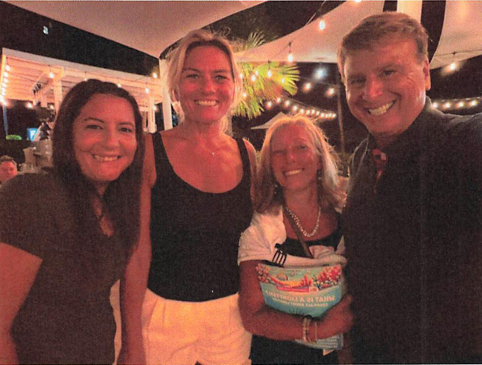Paula Huerta, Andrea Muller, Kristan Almquist, and Roger Muller with the "What is a Lionfish?" book